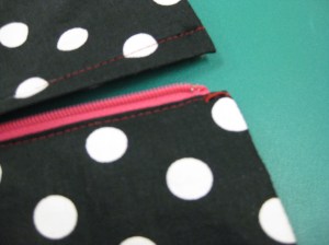 Thread bar on underside; hook on upper side.