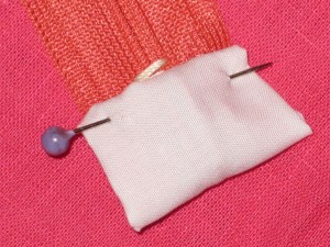 Fold to other side and stitch in place