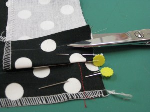 Fold seam allowance back over the facing and pin in place